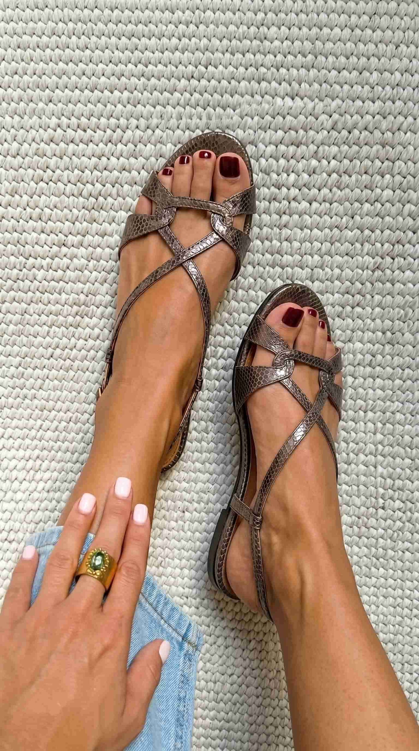 Low-heeled, open-toe, bronze snake-print slingback sandals